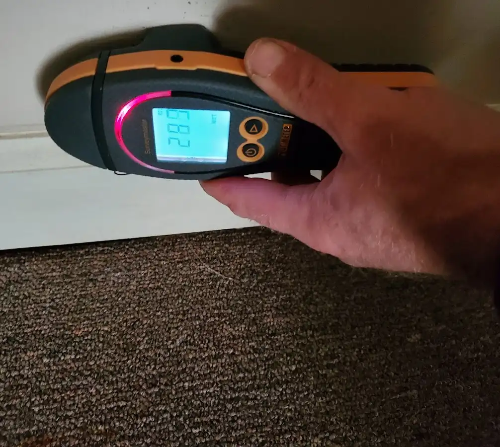 Moisture detection at baseboard during Storm Damage Restoration in Monee